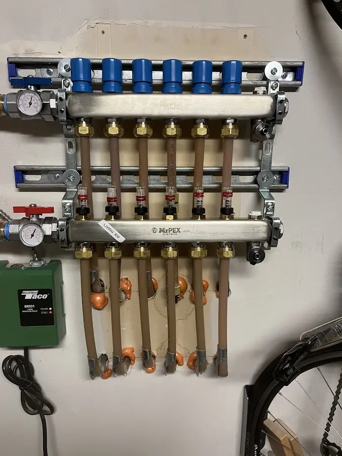 Plumber performing Water Heater Repair at a residential property in Lenexa